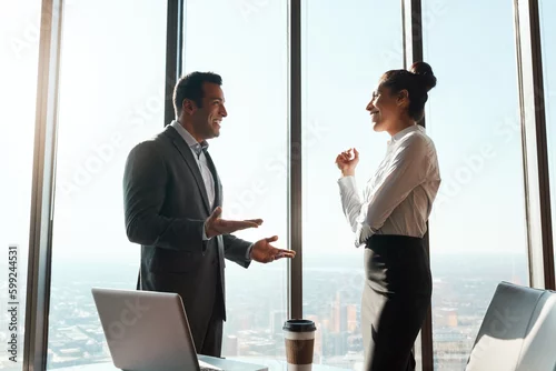 Obraz Their collaborations always lead to success. two businesspeople having a discussion in an office.