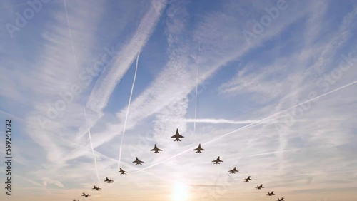 Unbranded military fighter jets flying overhead in a V-shaped formation at sunrise - seamless looping.