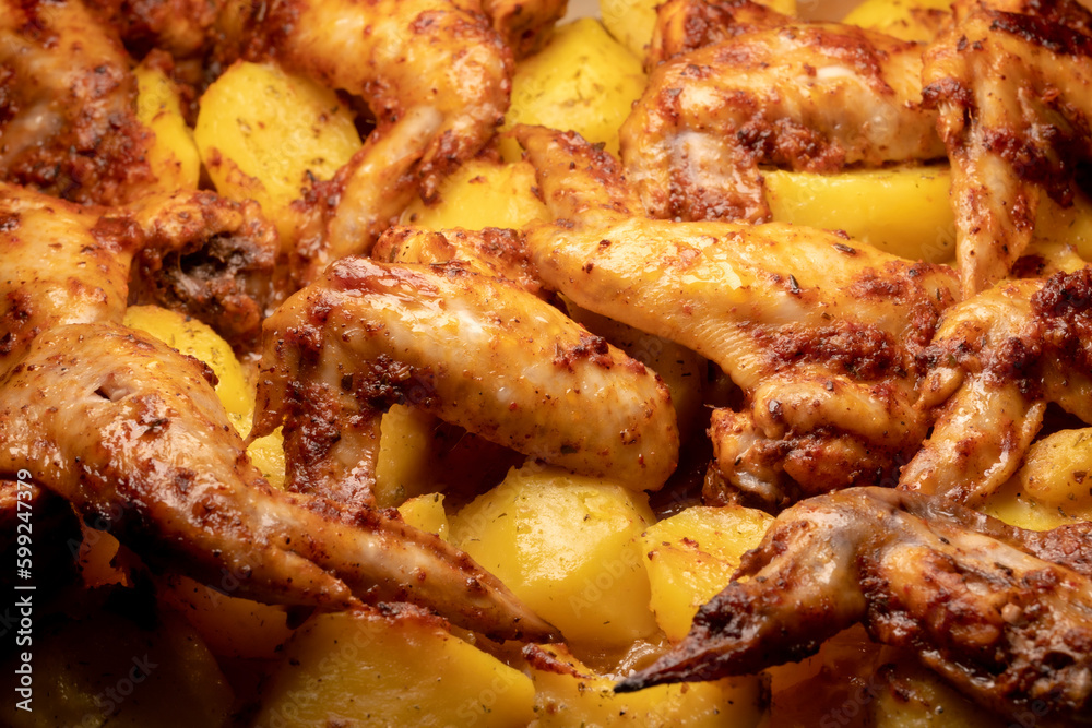 Oven baked chicken wings with potato pieces Oven baked chicken wings with potato pieces