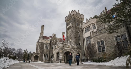 time lapse of main entrance of casa loma with tourists