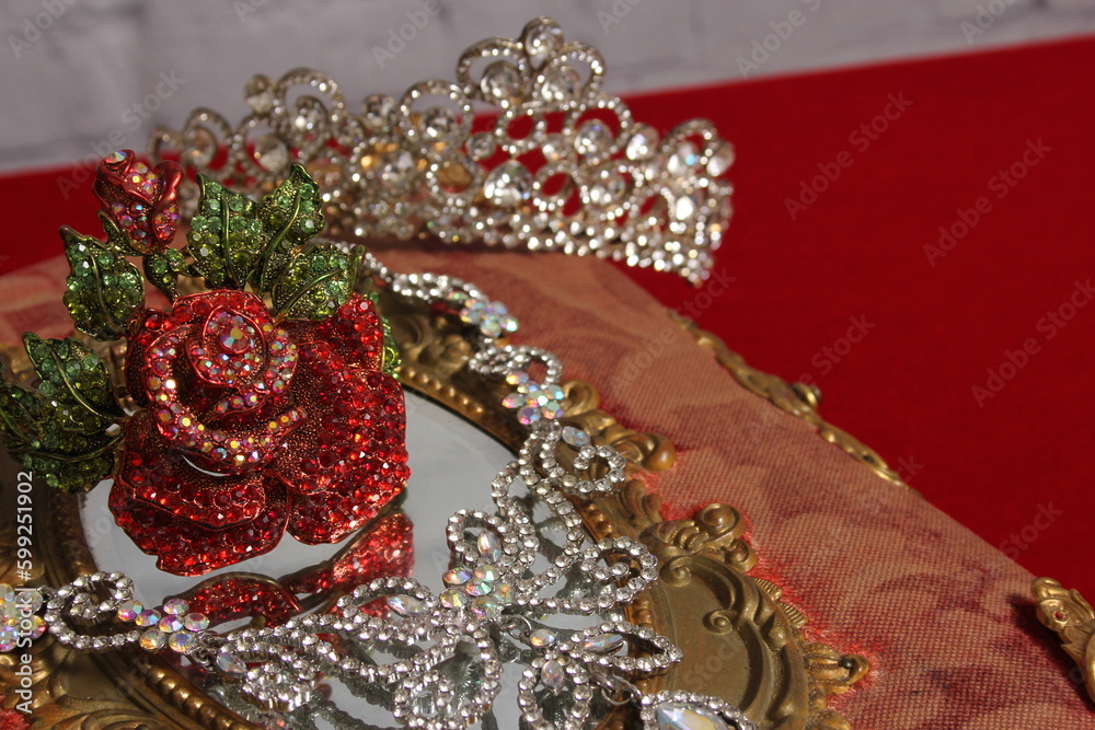 Obraz premium Crystal Rose Bracelet on Antique Book With Crystal Rhinestone Necklace