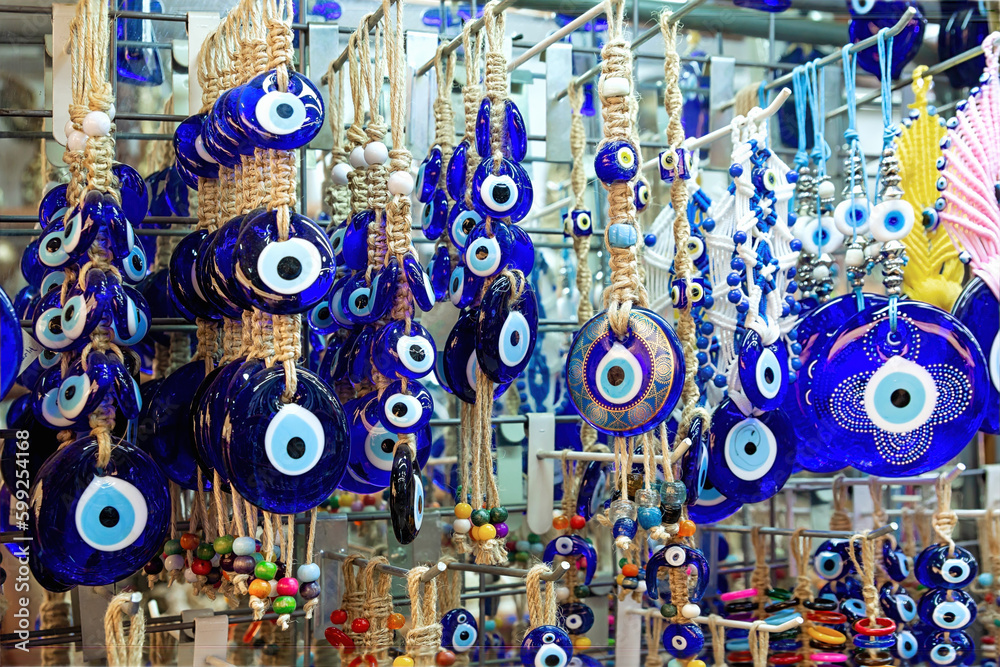 Fototapeta premium Turkish Eye amulet or Nazar Amulet in the Grand Bazaar in Istanbul. The evil eye is a curse or legend believed to be cast by a malevolent glare, usually given to a person when they are unaware.