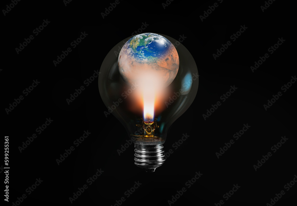 Burning candle in the light bulb with bulb isolated on black background - Light bulb with world inside and Mars Burning candle in the light bulb with bulb isolated on black background - Light bulb with world inside and Mars