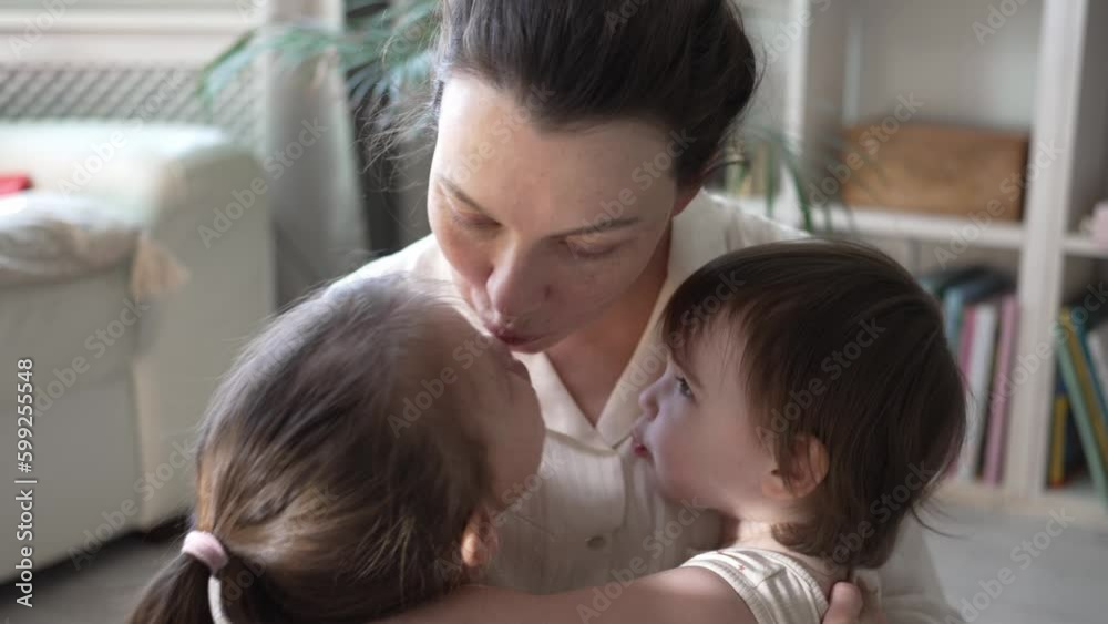 Mother Playing And Hugging With Two Little Daughters Mother Playing And Hugging With Two Little Daughters
