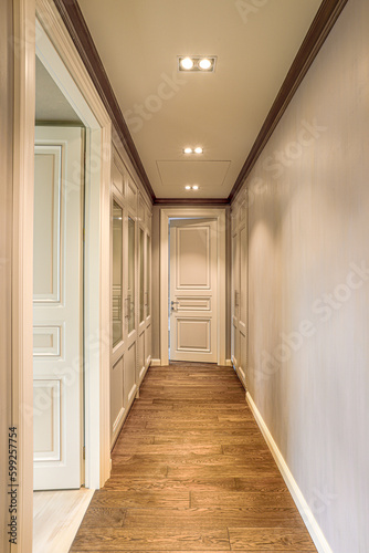 luxury corridor interior design with white walls, white wooden doors, parquet floor