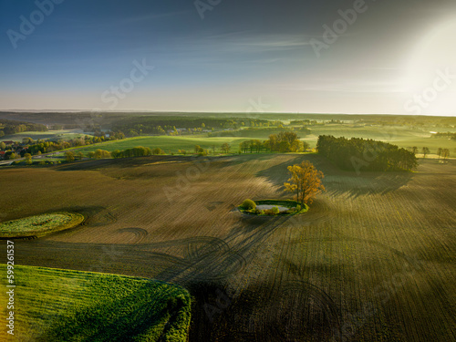 Warmia and Mazury - spring agricultural landscape at sunrise, Gietrzwałd near Olsztyn.