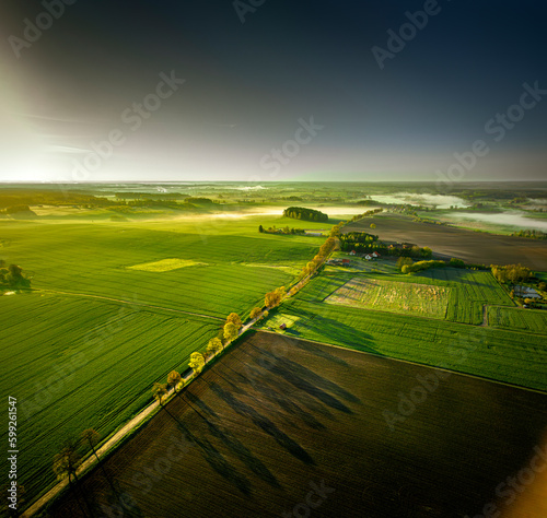 Fototapeta Naklejka Na Ścianę i Meble -  Warmia and Mazury - spring agricultural landscape at sunrise, Gietrzwałd near Olsztyn.