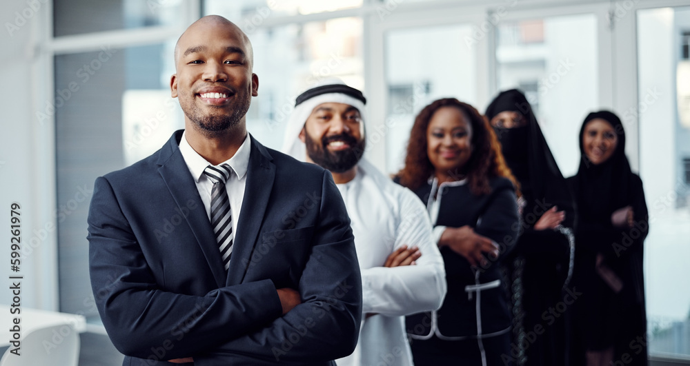 Its easy to get behind a successful leader. Cropped portrait of a handsome young businessman standing at the head of a line of his colleagues. Its easy to get behind a successful leader. Cropped portrait of a handsome young businessman standing at the head of a line of his colleagues.