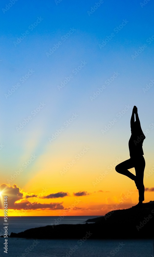Yoga Silhouette on a mountain near sea. yoga pose. international yoga day. 21 june. 2023.
