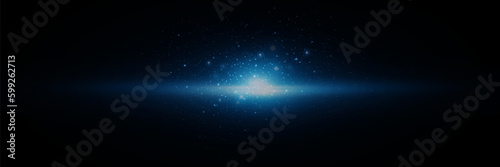 Glow effect. Blue glowing particles, stars. Shiny particles explode. On a black background.