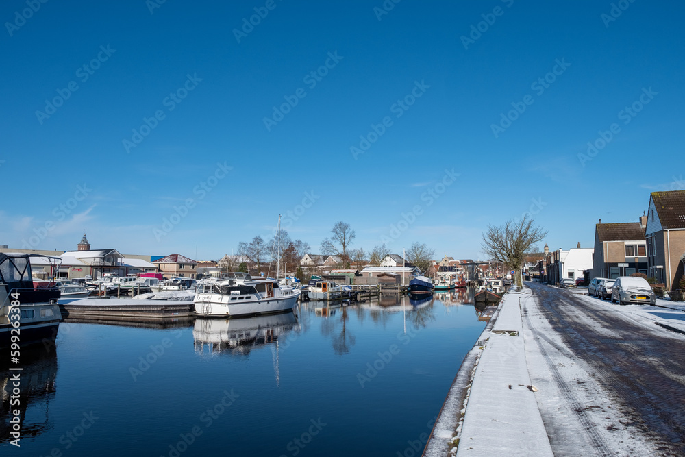 Water canal in the historic city of Sneek and winter