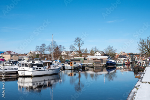 Water canal in the historic city of Sneek and winter