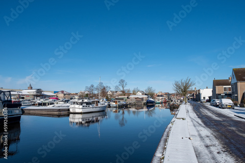 Water canal in the historic city of Sneek and winter