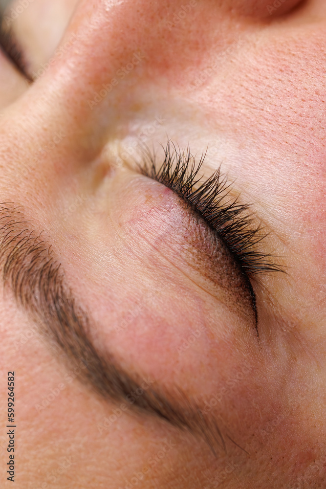 Obraz premium Tattooed between eyelashes. Permanent make-up of the eyelids, eyelash tattooing.