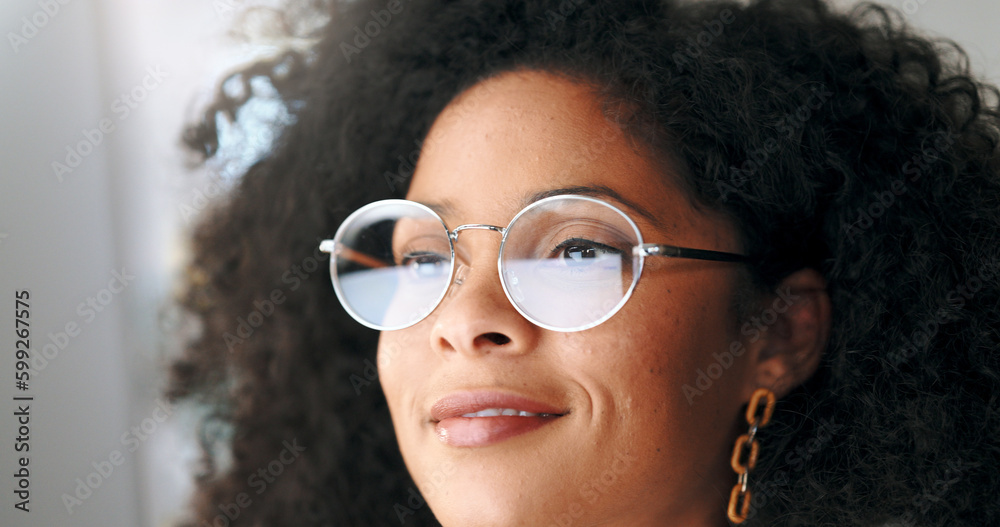 Face portrait of a satisfied business woman reading emails on a computer. Isolated closeup of designer at a workstation. Smiling African American female looking a display or watching content. Face portrait of a satisfied business woman reading emails on a computer. Isolated closeup of designer at a workstation. Smiling African American female looking a display or watching content.