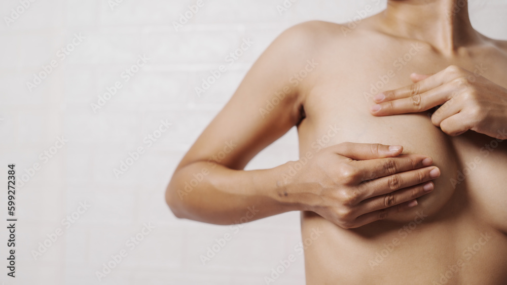 Young asian woman examining breast mastopathy or signs of breast cancer, Closeup Sexy Topless Naked Female With Breast Cancer Awareness Young asian woman examining breast mastopathy or signs of breast cancer, Closeup Sexy Topless Naked Female With Breast Cancer Awareness