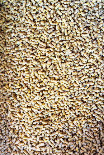 Portrait view of Chicken feed pellets, close up of granulated poultry food texture