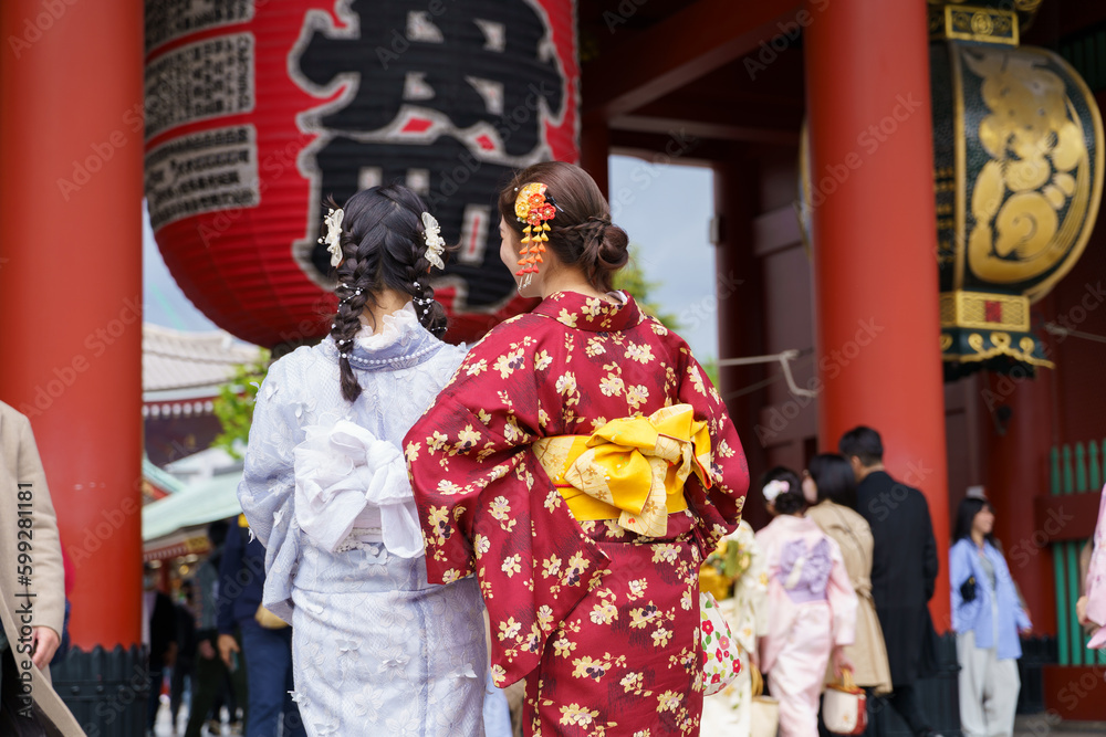 Young girl wearing Japanese kimono standing  in Kyoto, Japan. Kimono is a Japanese traditional garment. The word 