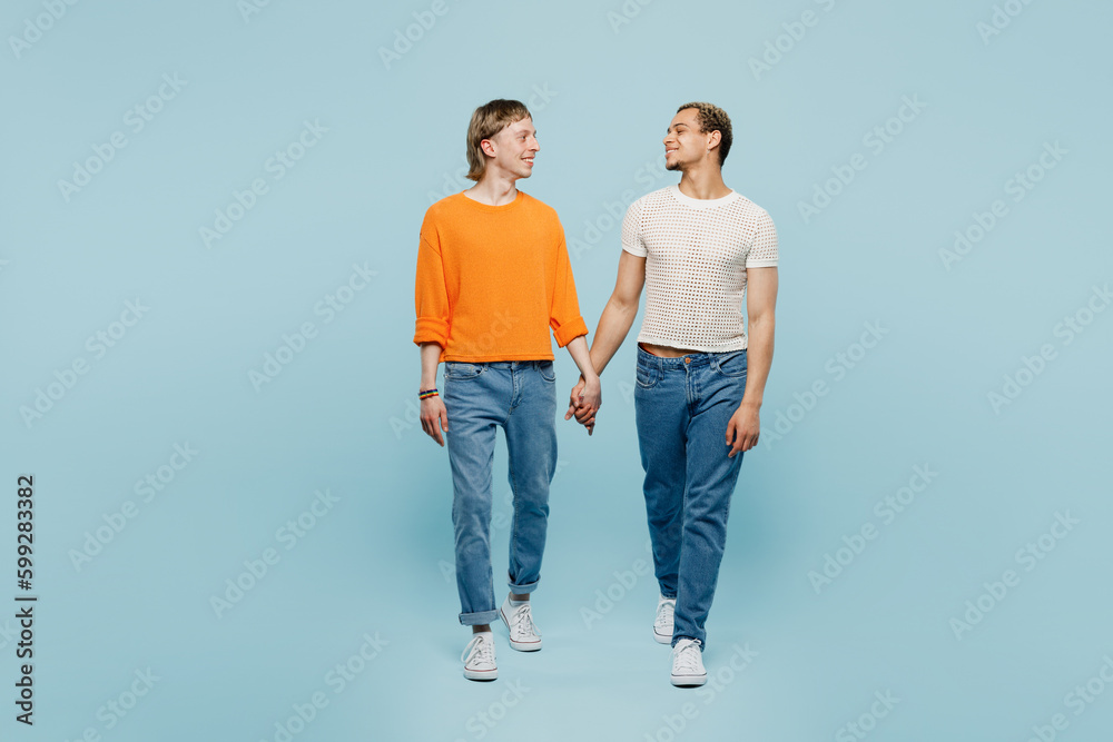 Full body young couple two gay men wear casual clothes together walk go