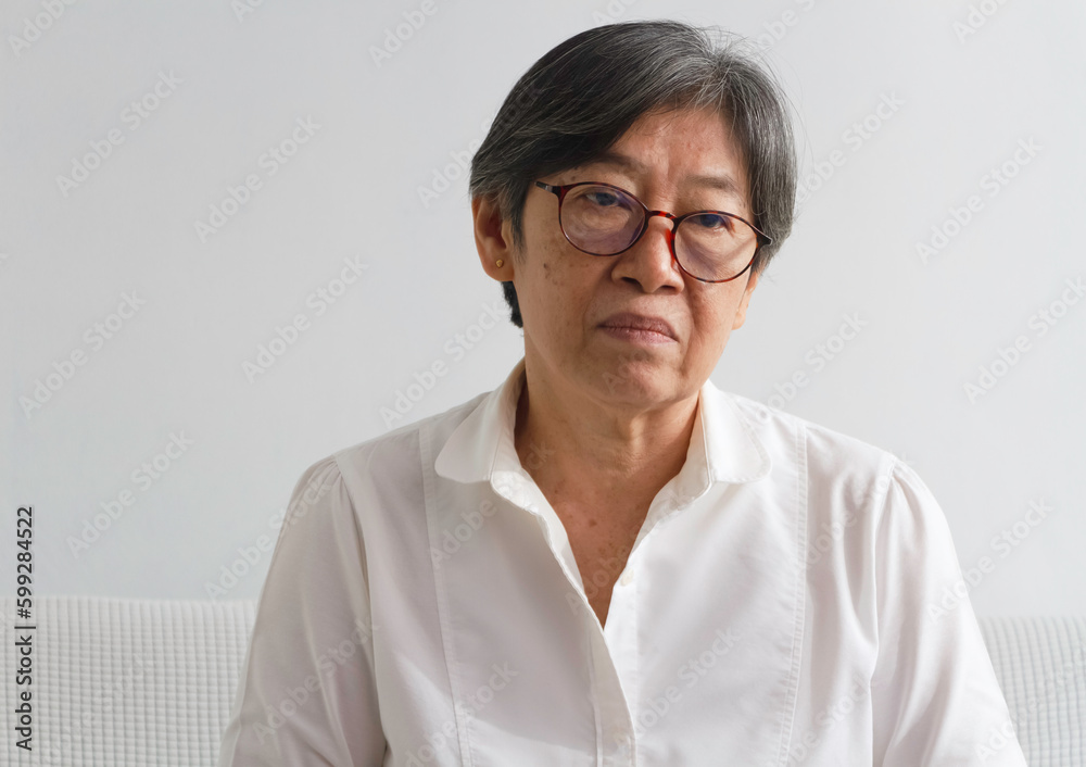 Portrait of old lady with wrinkle on her face,wearing glasses,looking with sadness eyes, Portrait of old lady with wrinkle on her face,wearing glasses,looking with sadness eyes,