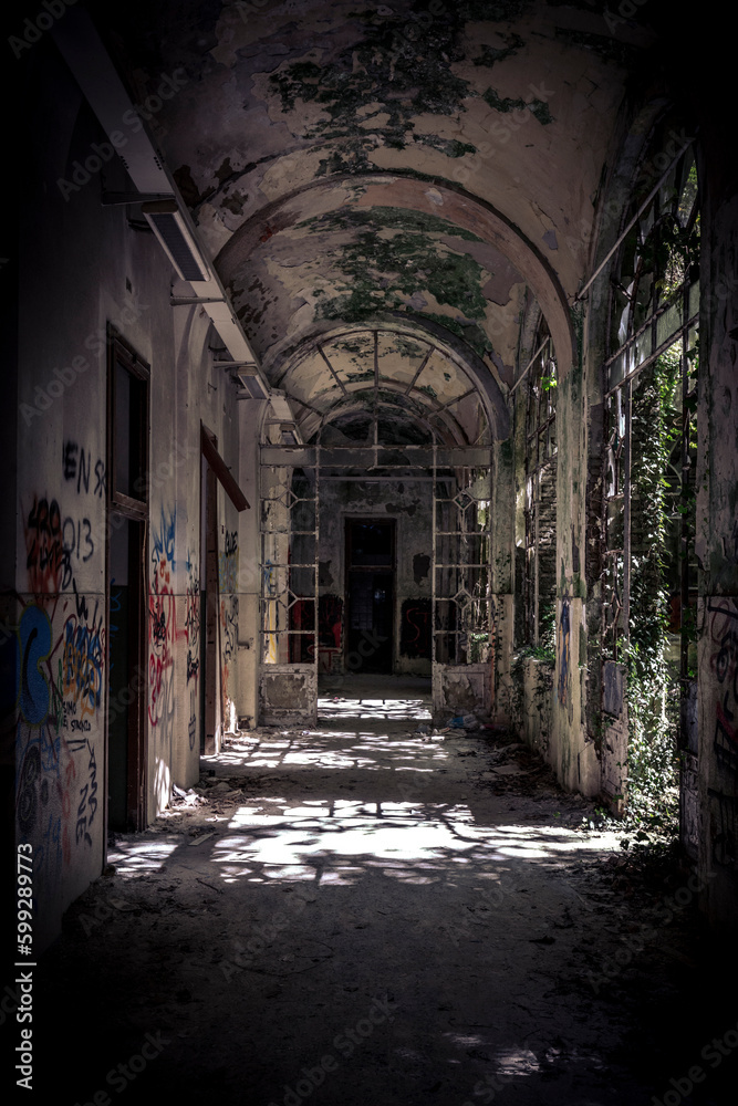 inside a decaying, vandalised  structure