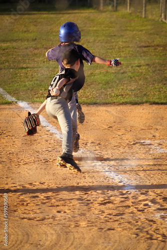 Safe , youth baseball players