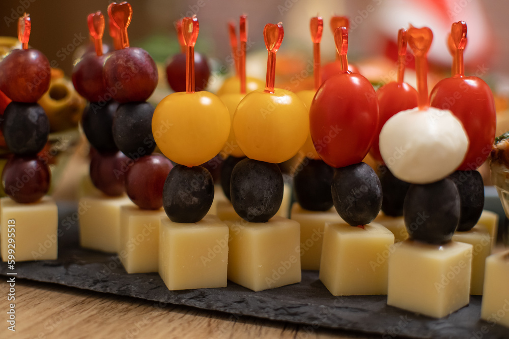light snacks on the festive table, canapes, sandwiches with fish, light snacks on the festive table, canapes, sandwiches with fish,