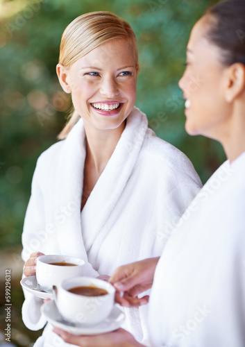 Girls day was an awesome idea. Two young women having coffee in their bathrobes at the day spa.
