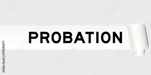 Ripped gray paper background that have word probation under torn part photo