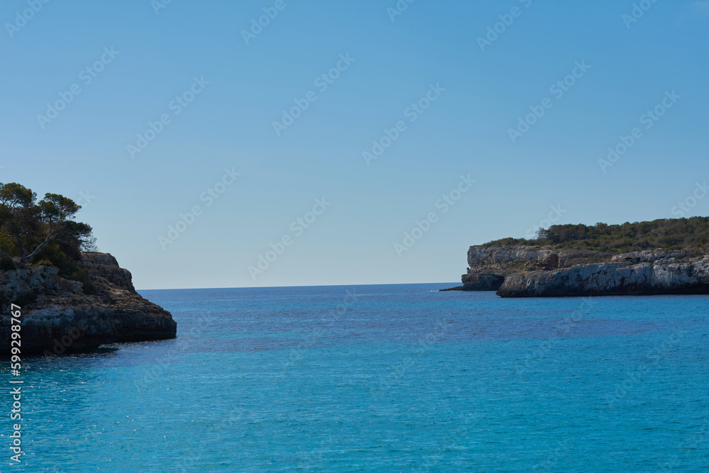 Crystal clear blue waters at S'Amarador beach and Cala Mondragó on the island of Mallorca. Balearic Islands. Spain