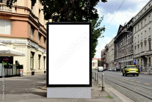 blank digital ad panel. billboard display. empty white lightbox sign at busstop. glass structure. mockup template panel. city transit station. urban street setting. outdoor advertising.