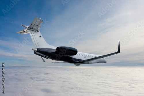 Fototapeta Naklejka Na Ścianę i Meble -  Modern luxury private jet flies in the air above the clouds