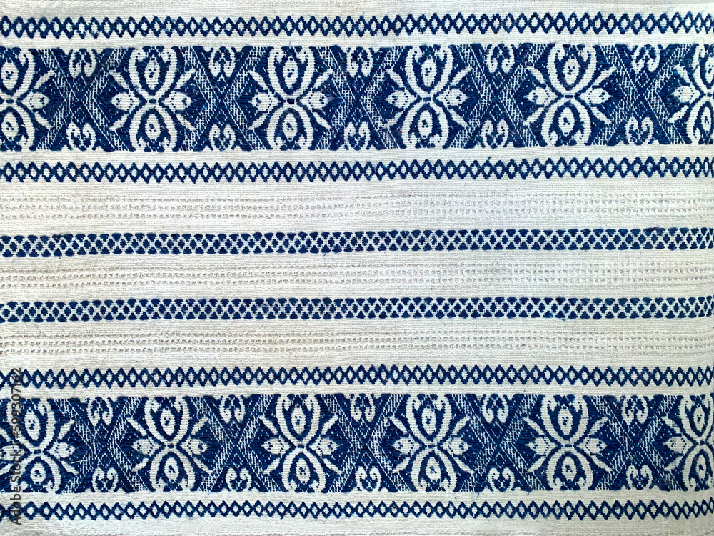 Blue and white kitchen textile texture background. Closeup of natural linen or cotton vintage dish towel  or tablecloth fabric. Eastern European pattern print or embroidery ornament on picnic cloth.