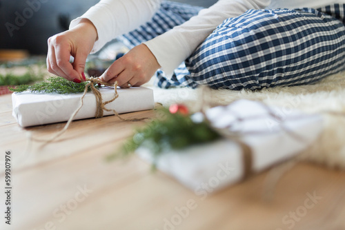 Woman wrapping Christmas gift