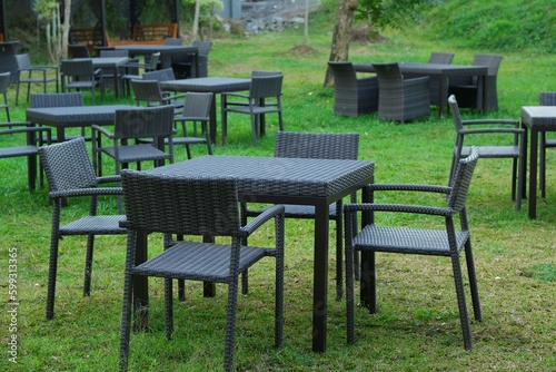 Tableable and chairs for outdoor with nature as background. Kursi dan meja taman