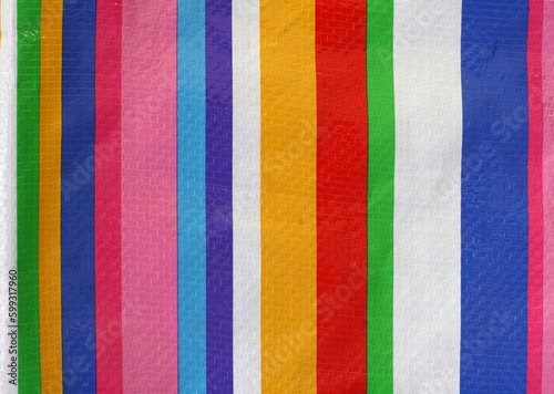 Plastic texture with colorful stripes for making fashion bags or fabric materials.