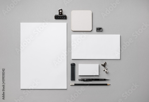 Blank corporate identity template. Photo of blank stationery set on gray paper background. Flat lay.