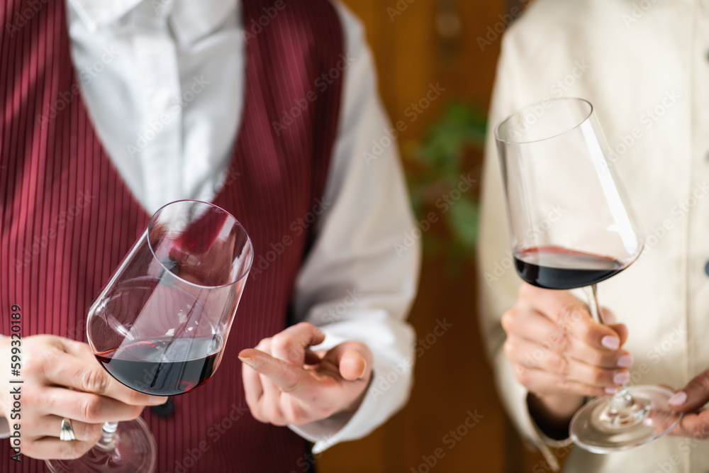 Sommelier evaluates appearance of a wine.