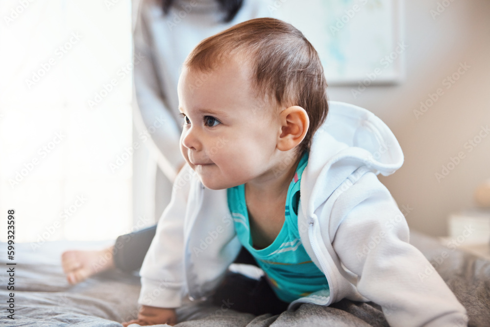 The age of curiosity. an adorable baby girl playing on the bed at home. The age of curiosity. an adorable baby girl playing on the bed at home.