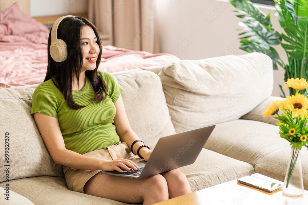 Portrait of a happy asian woman relaxing at home Portrait of a happy asian woman relaxing at home