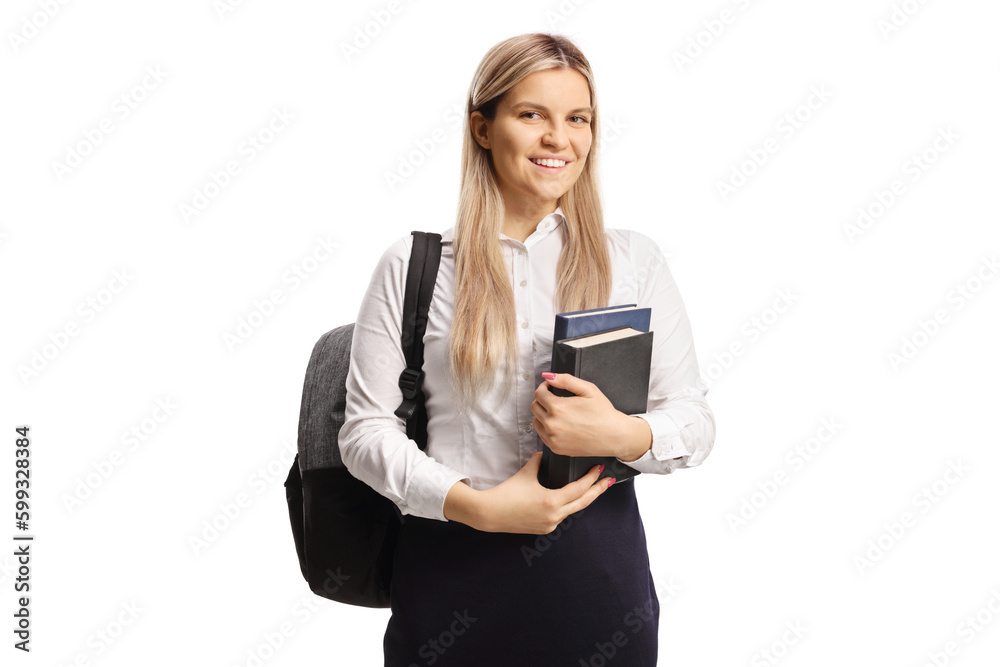 Female student holding books and smiling Female student holding books and smiling