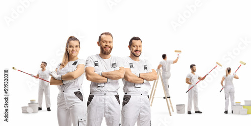 Team of professional painters decorating a wall