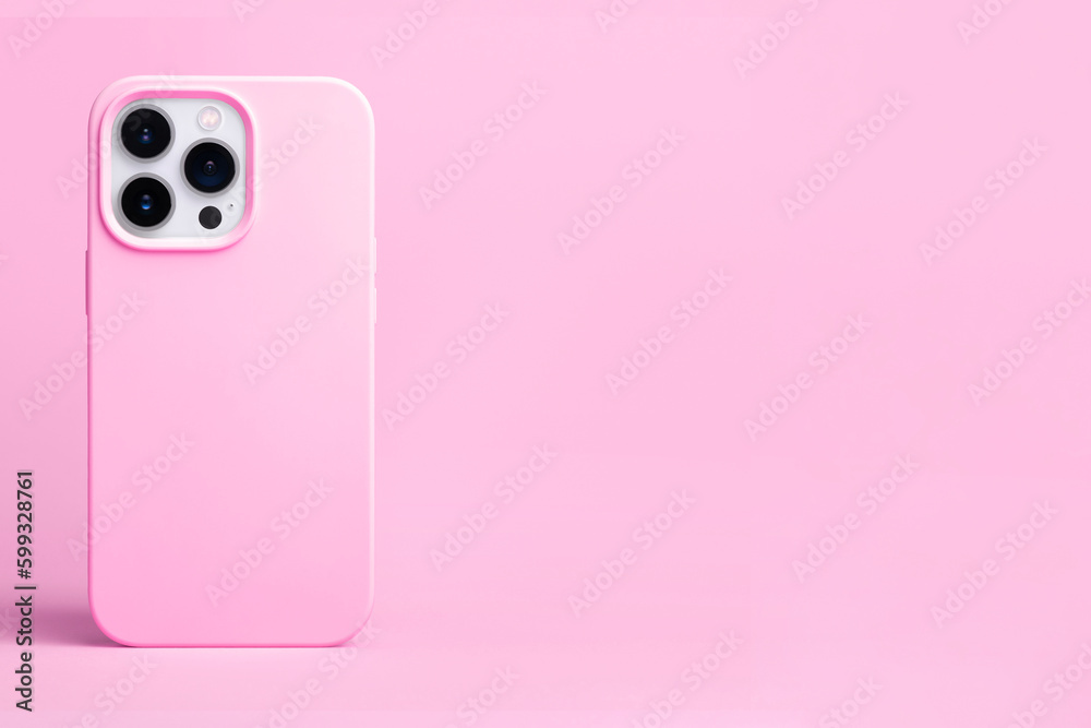 pink phone case mockup. iPhone 14 pro max and 13 mock up back view isolated on pink background, banner with place for text on the right in monochrome colors pink phone case mockup. iPhone 14 pro max and 13 mock up back view isolated on pink background, banner with place for text on the right in monochrome colors