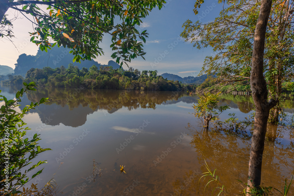 Natural background of a large reservoir in Krabi,Thailand(Nong Thale)atmosphere surrounded by mountains,trees of various sizes, blown through the wind,blurred cool during the day,a viewpoint of travel Natural background of a large reservoir in Krabi,Thailand(Nong Thale)atmosphere surrounded by mountains,trees of various sizes, blown through the wind,blurred cool during the day,a viewpoint of travel