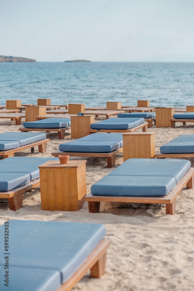 Beautiful beach. Chairs on the sandy beach near the sea. Summer holiday and vacation concept for tourism. Inspirational tropical landscape. Tranquil scenery, relaxing beach, tropical landscape design Beautiful beach. Chairs on the sandy beach near the sea. Summer holiday and vacation concept for tourism. Inspirational tropical landscape. Tranquil scenery, relaxing beach, tropical landscape design