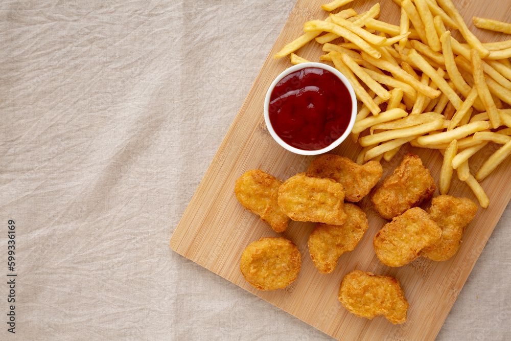 Naklejka premium Chicken Nuggets and French Fries with Ketchup Ready to Eat. Flat lay, overhead, from above.