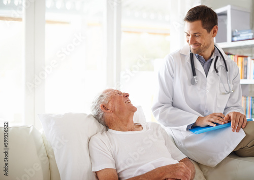 Youre doing great. a handsome male doctor with a happy elderly patient.