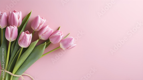 Spring flower composition featuring a bouquet of pink tulips on a pastel pink background. Generative AI