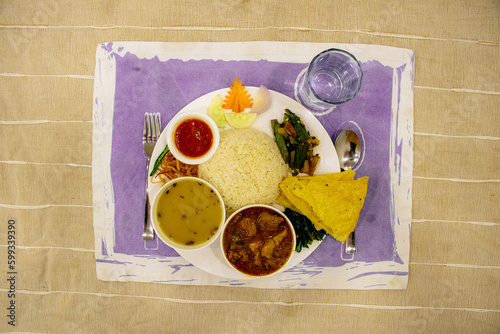 Nepali Dal Bhaat Tarkari Traditional Nepali Thali WIth Rice Lentil, Curry and Vegetables photo