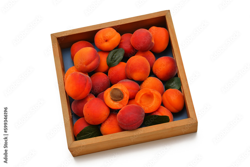 fresh apricots in a wooden box isolate on white background fresh apricots in a wooden box isolate on white background